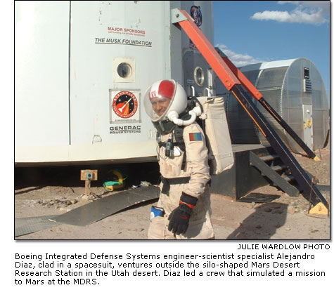 Alejandro Diaz,clad in a spacesuit, ventures outside the silo-shaped Mars Desert Research Station