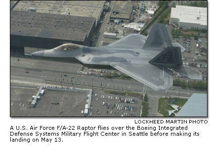 A U.S. Air Force F/A-22 Raptor flying over the Boeing Integrated Defense Systems Military Flight Center in Seattle