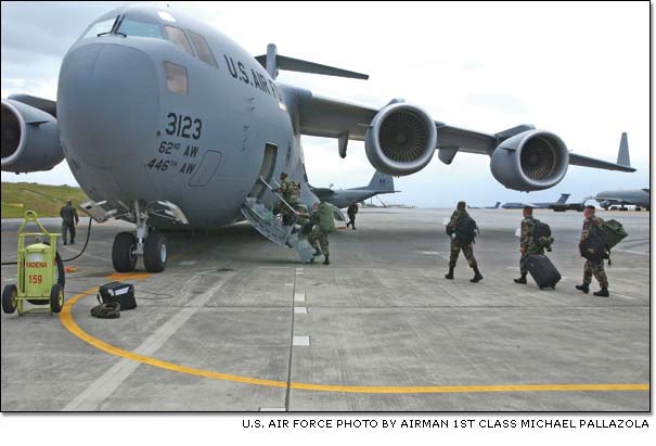 A team from several U.S. Air Force squadrons board a Boeing-built C-17 Globemaster III