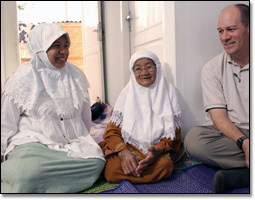 Seipel visits with an 85-year-old grandmother named Ibu Zainabum and her granddaughter, Yulie Dian Melani